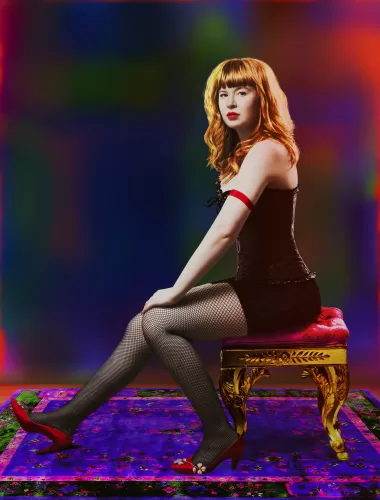 A full-body image of author Flora Collins