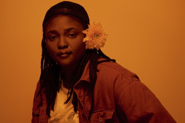 An image of singer and songwriter, Joy Oladokun, by photographer Brian Higbee