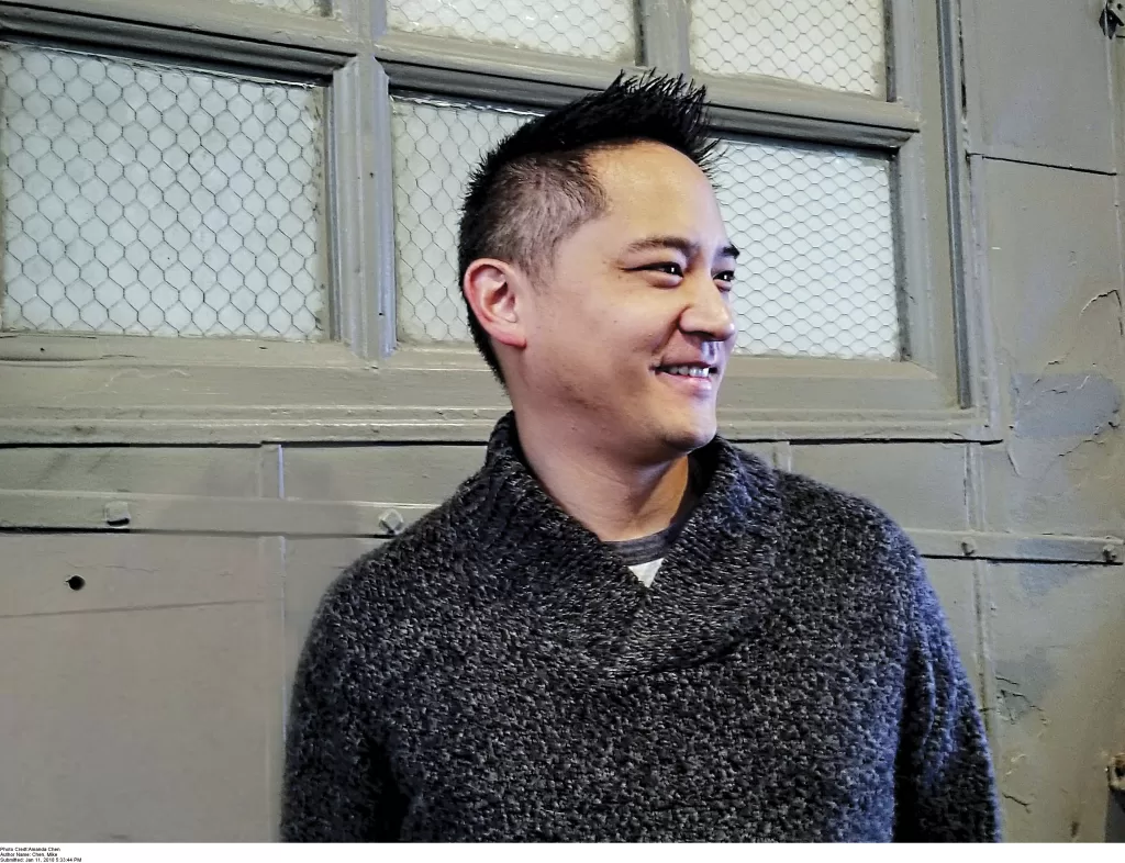 A side headshot of author, Mike Chen