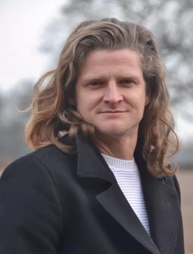 A headshot of author, James Goodhand