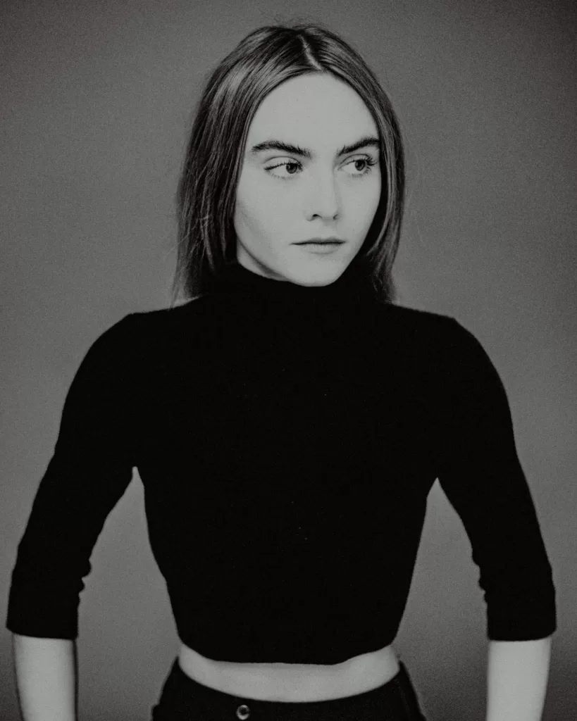 A black and white image of actress and singer, Eli Riccardi