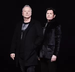 An image of Simple Minds band members, L : Jim Kerr, R: Charlie Burchill / Photo Credit: Dean Chalkley