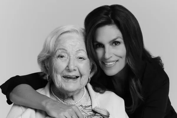 An image of Cindy Crawford hugging 99 year-old Holocaust survivor, Ella Mandel