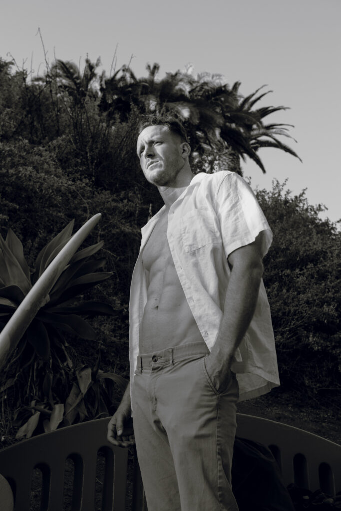 An angled full-body image of vertical actor, Aaron Oberst